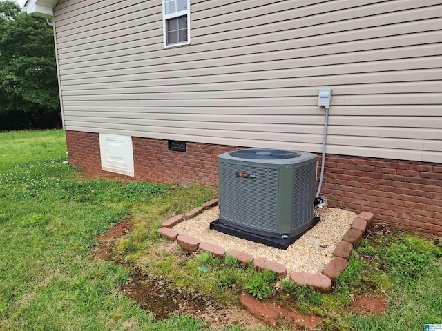 exterior view of crawl space and cooling unit