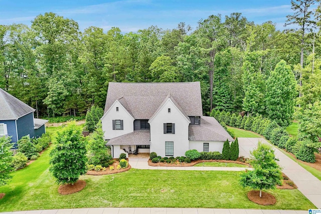 2126 Raines Run, Birmingham, AL 35242 - view of front of house featuring stucco siding, a shingled roof, a front lawn, and concrete driveway