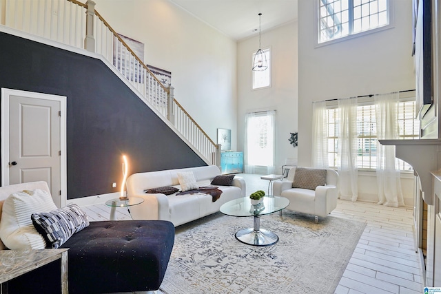 2126 Raines Run, Birmingham, AL 35242 - living area featuring a towering ceiling, stairs, and wood finished floors