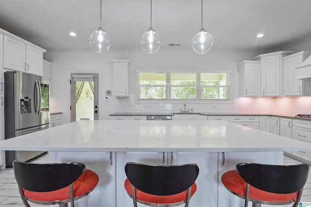 2126 Raines Run, Birmingham, AL 35242 - kitchen with appliances with stainless steel finishes, backsplash, crown molding, white cabinetry, and recessed lighting