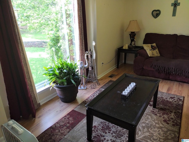 living room with wood finished floors and baseboards