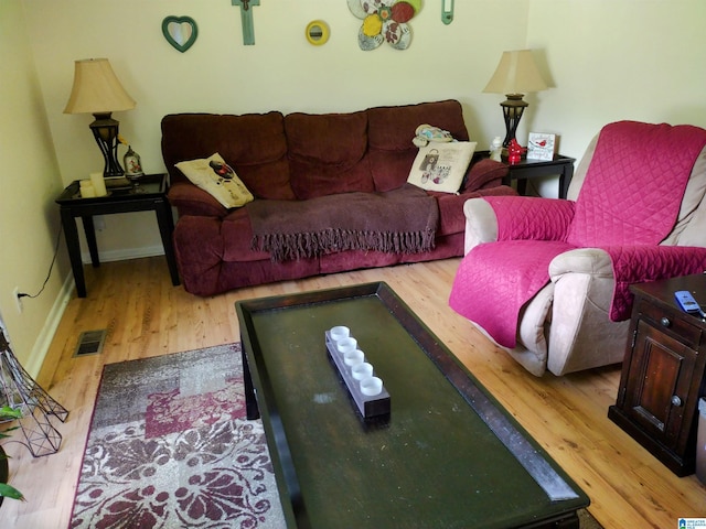 living room with wood finished floors and baseboards