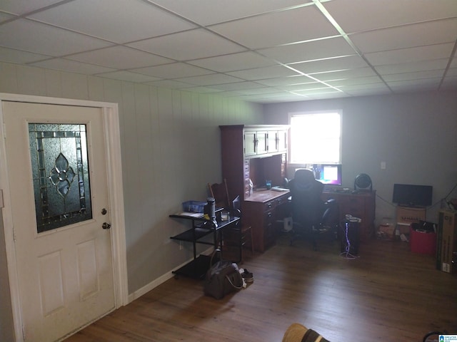 home office featuring wood finished floors and a paneled ceiling