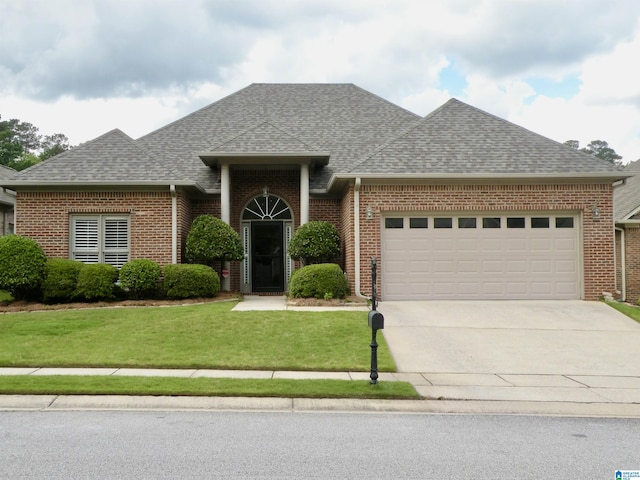 view of front of house featuring a shingled roof, a garage, and brick siding