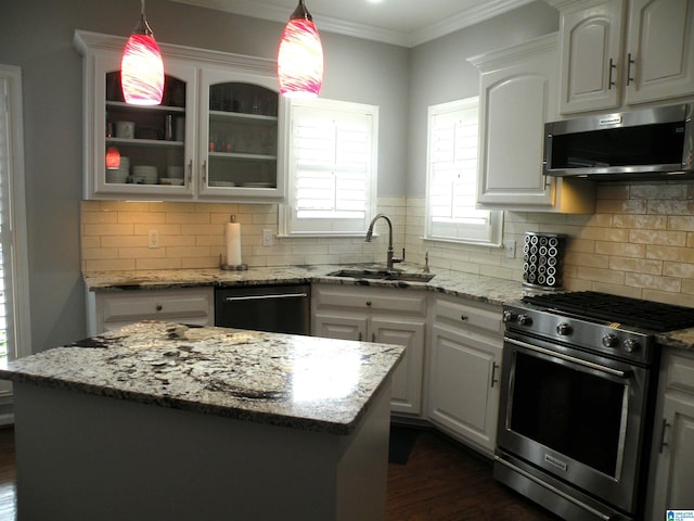 kitchen featuring appliances with stainless steel finishes, a sink, dark wood-type flooring, glass insert cabinets, and white cabinets