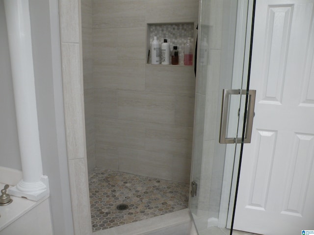 bathroom with a shower stall