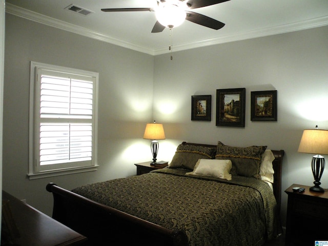 bedroom featuring ornamental molding and a ceiling fan