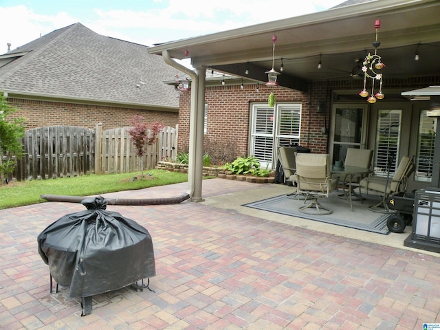 view of patio / terrace featuring fence, ceiling fan, and area for grilling