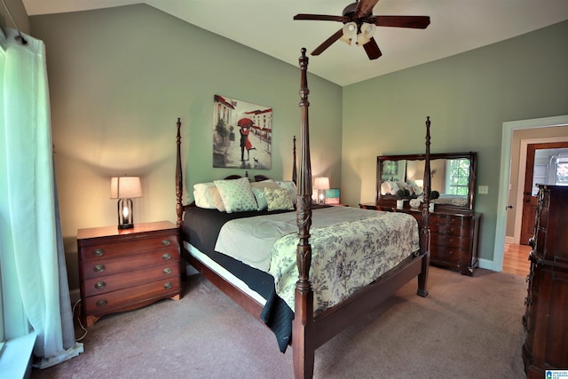carpeted bedroom featuring vaulted ceiling, a ceiling fan, and baseboards