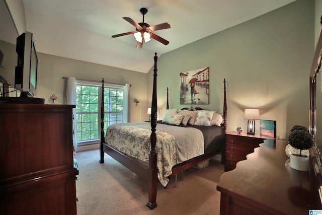 carpeted bedroom featuring lofted ceiling and ceiling fan
