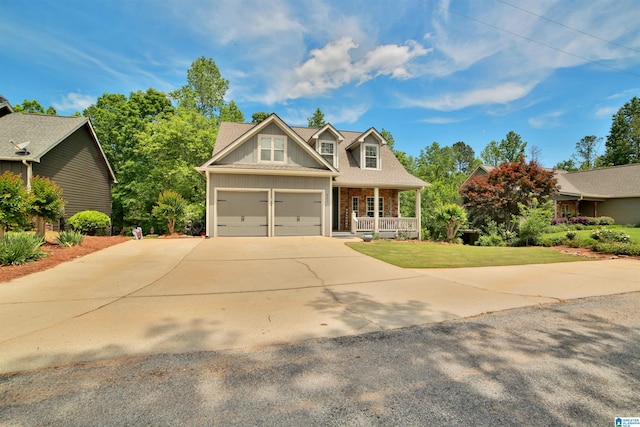 view of front of property with covered porch, concrete driveway, board and batten siding, brick siding, and a front lawn