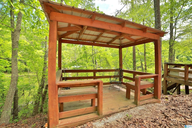 wooden deck with a forest view