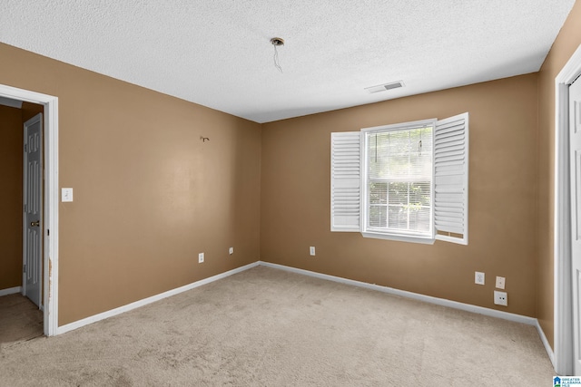 5826 Willow Crest Dr, Pinson, AL 35126 - carpeted spare room featuring a textured ceiling and baseboards