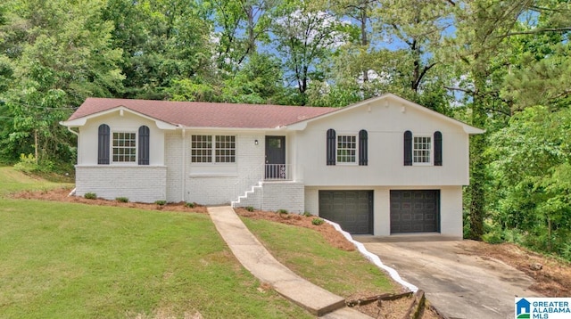 view of front facade featuring an attached garage, driveway, brick siding, a front yard, and view of scattered trees