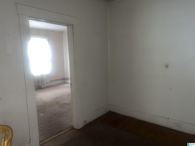 unfurnished room featuring dark wood finished floors and baseboards