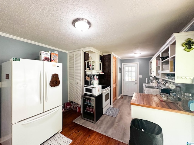 18981 Remlap Dr, Remlap, AL 35133 - kitchen with freestanding refrigerator, open shelves, butcher block counters, crown molding, and wood finished floors