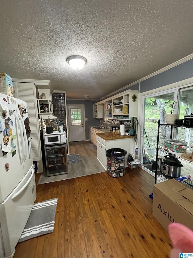 18981 Remlap Dr, Remlap, AL 35133 - kitchen with white appliances, open shelves, wooden counters, a textured ceiling, and crown molding