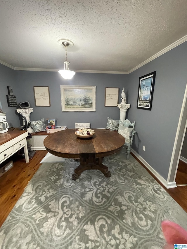 18981 Remlap Dr, Remlap, AL 35133 - dining space with a textured ceiling, wood finished floors, ornamental molding, and baseboards
