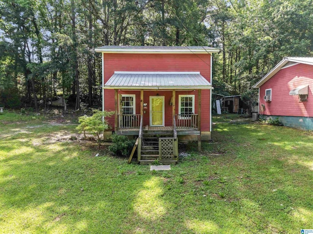 155 W Curtis Rd, Sylacauga, AL 35150 - view of outdoor structure featuring covered porch, stairs, and view of wooded area