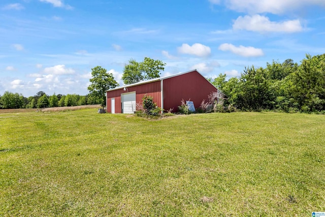 390 Chamblee Ln, Warrior, AL 35180 - view of grassy yard with a detached garage and an outbuilding