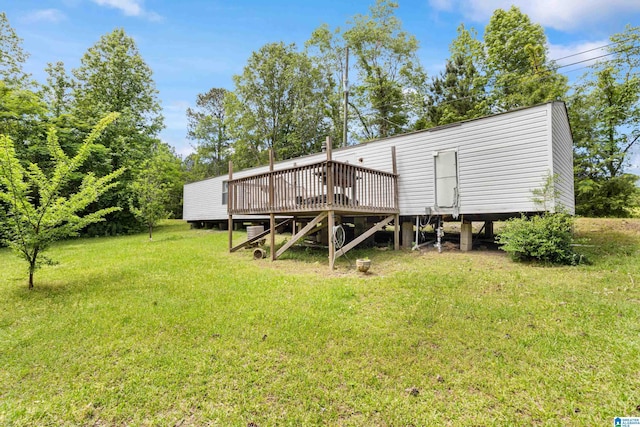 390 Chamblee Ln, Warrior, AL 35180 - rear view of property with a deck and a lawn