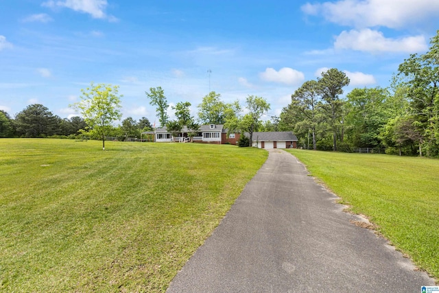 390 Chamblee Ln, Warrior, AL 35180 - view of front of home featuring driveway, a front yard, and an attached garage