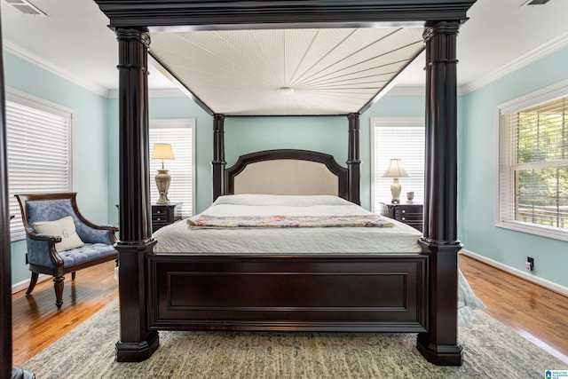 390 Chamblee Ln, Warrior, AL 35180 - bedroom with crown molding, wood finished floors, and baseboards