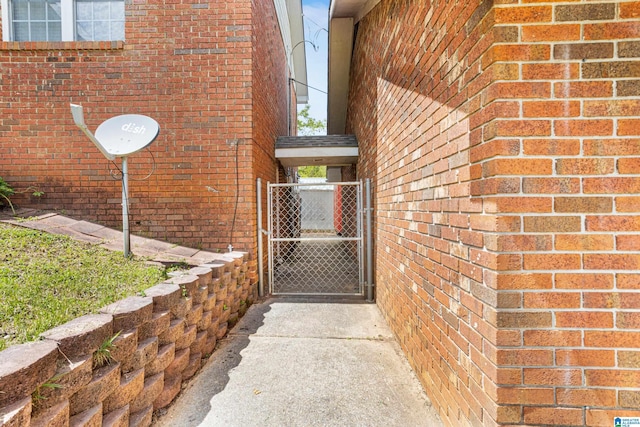 390 Chamblee Ln, Warrior, AL 35180 - entrance to property featuring a gate and brick siding
