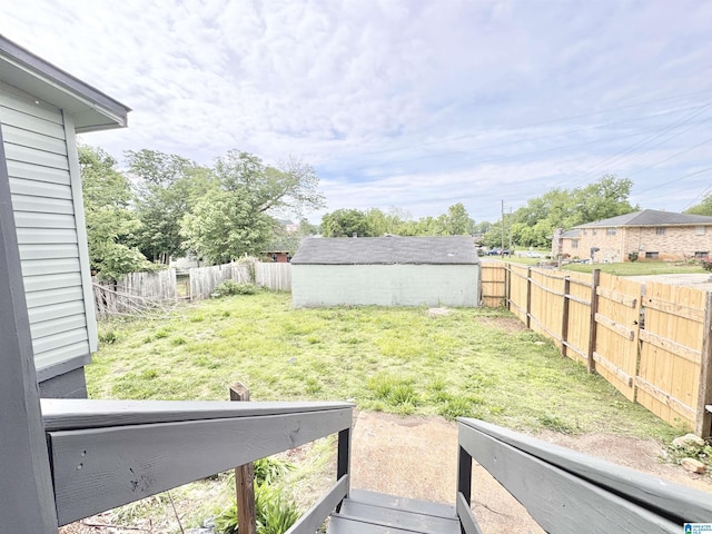 view of yard with a storage shed and an outdoor structure