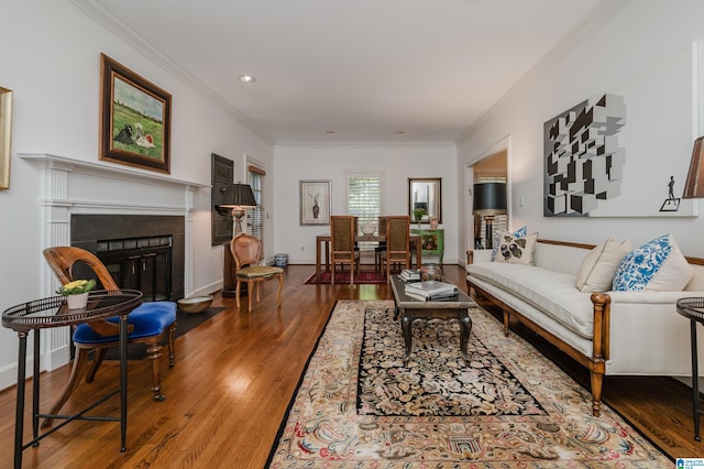 1209 29th St S, Birmingham, AL 35205 - living room featuring crown molding, wood finished floors, baseboards, and a tiled fireplace