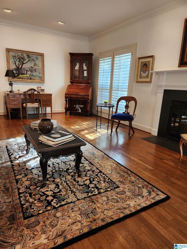 1209 29th St S, Birmingham, AL 35205 - living room featuring ornamental molding, baseboards, wood finished floors, and a fireplace with flush hearth