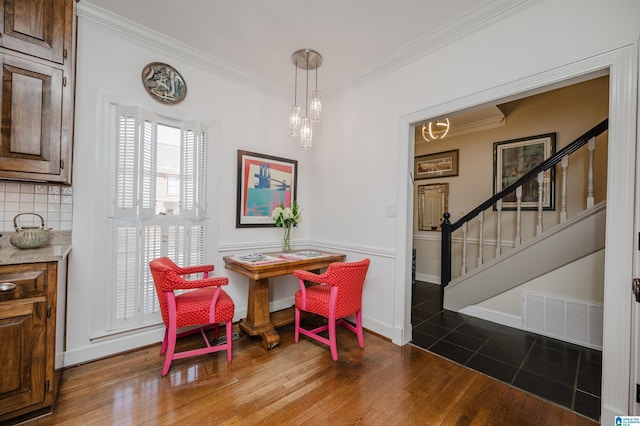 1209 29th St S, Birmingham, AL 35205 - dining room featuring crown molding, stairway, and wood finished floors