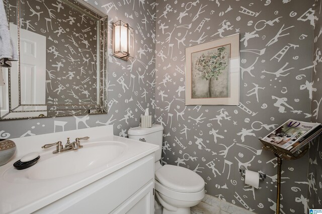 1209 29th St S, Birmingham, AL 35205 - half bathroom with toilet, wallpapered walls, and vanity