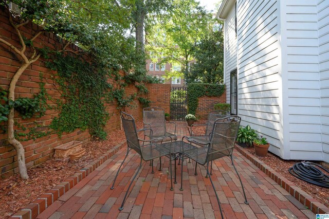 1209 29th St S, Birmingham, AL 35205 - view of patio / terrace featuring fence and outdoor dining space