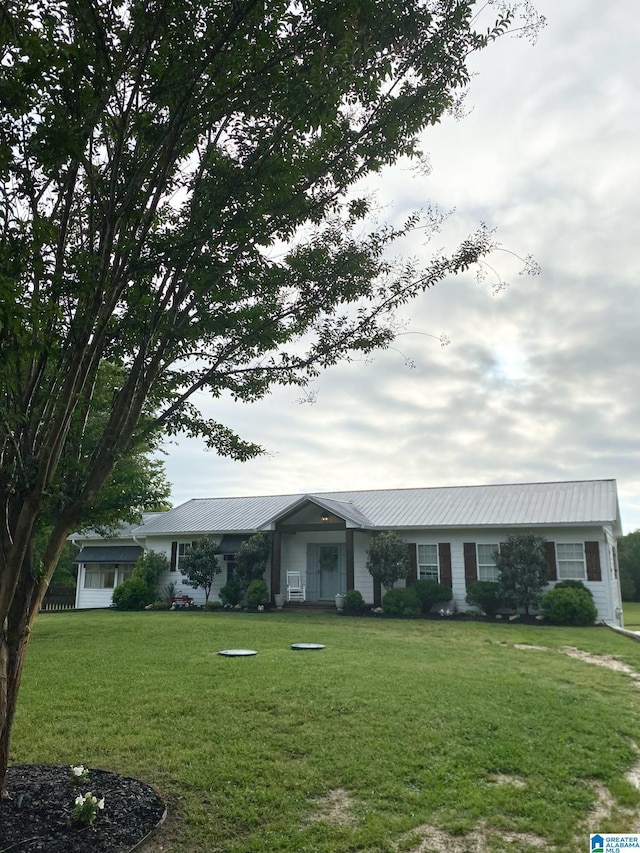 278 Harpers Ln, Ashville, AL 35953 - ranch-style home with a front yard and metal roof