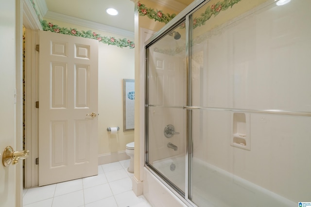 full bathroom with tile patterned floors, enclosed tub / shower combo, toilet, ornamental molding, and baseboards