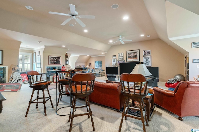 living area featuring a ceiling fan, light carpet, recessed lighting, and vaulted ceiling