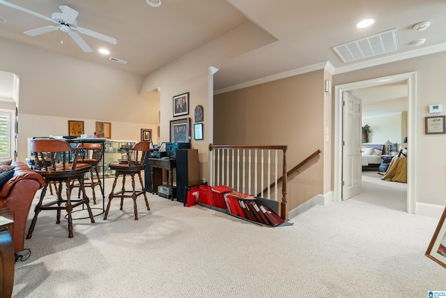 dining room with carpet, ornamental molding, a ceiling fan, baseboards, and recessed lighting