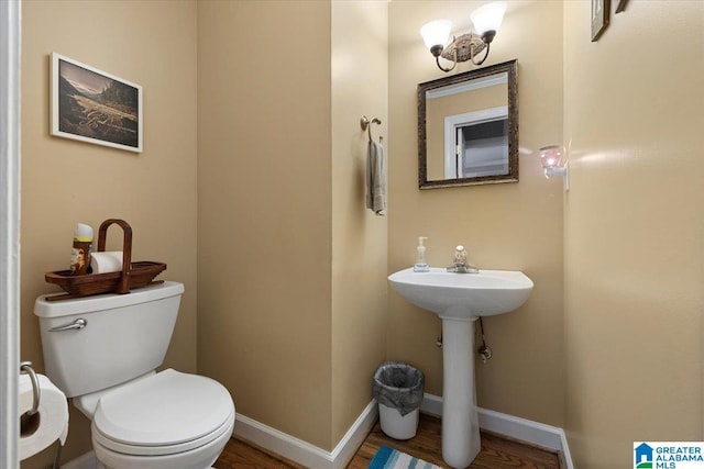 110 Drexal Dr, Oneonta, AL 35121 - bathroom featuring toilet, wood finished floors, baseboards, and a sink