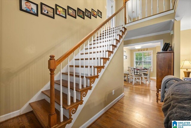 110 Drexal Dr, Oneonta, AL 35121 - stairway featuring ornamental molding, wood finished floors, baseboards, and a towering ceiling