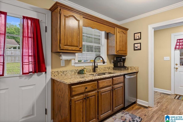 110 Drexal Dr, Oneonta, AL 35121 - kitchen with a sink, stainless steel dishwasher, ornamental molding, brown cabinetry, and light wood finished floors
