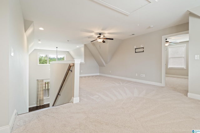 additional living space featuring attic access, ceiling fan, light carpet, vaulted ceiling, and recessed lighting
