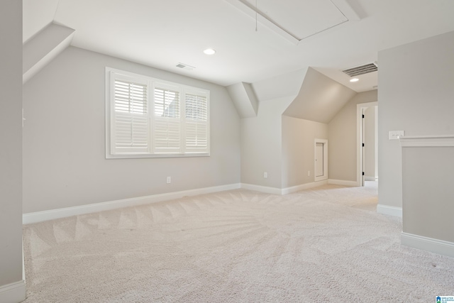 bonus room with lofted ceiling, carpet flooring, attic access, baseboards, and recessed lighting