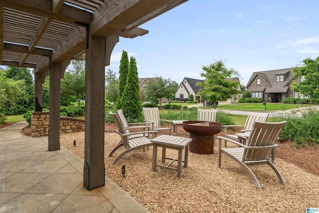 view of patio / terrace featuring a pergola and a fire pit