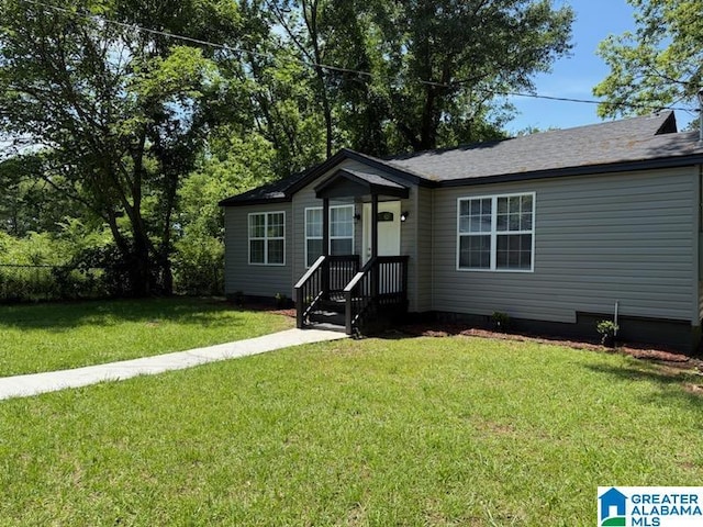 view of front of home with a front lawn and crawl space