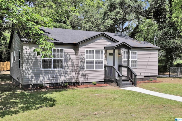 view of front of home with a shingled roof and crawl space