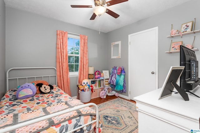 76 Pine Tree Ln, Alexandria, AL 36250 - bedroom featuring wood finished floors, ceiling fan, and baseboards