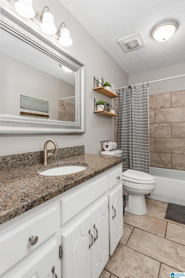76 Pine Tree Ln, Alexandria, AL 36250 - bathroom with vanity, toilet, shower / tub combo with curtain, and a textured ceiling
