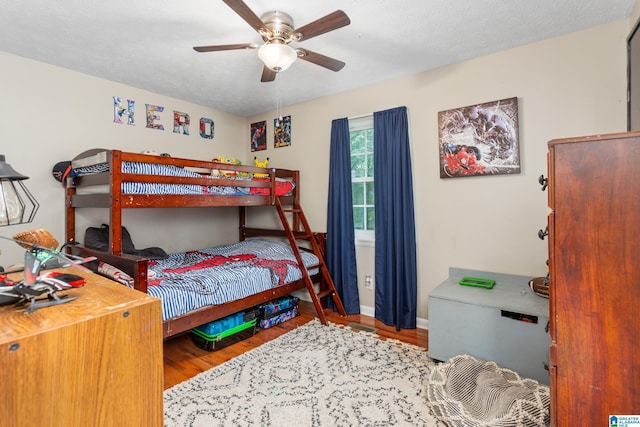 76 Pine Tree Ln, Alexandria, AL 36250 - bedroom featuring wood finished floors, a ceiling fan, and baseboards