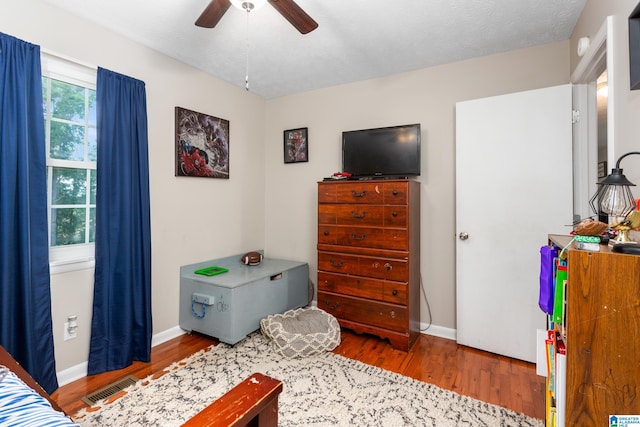76 Pine Tree Ln, Alexandria, AL 36250 - bedroom featuring wood finished floors, baseboards, and a ceiling fan